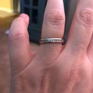 14K white gold channel set wedding ring.